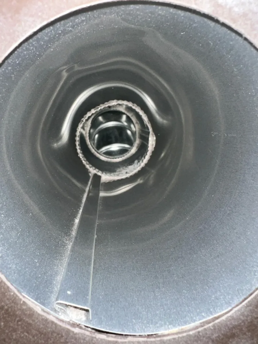 Inside a cleaned trunk line with the damper visible and clean duct walls